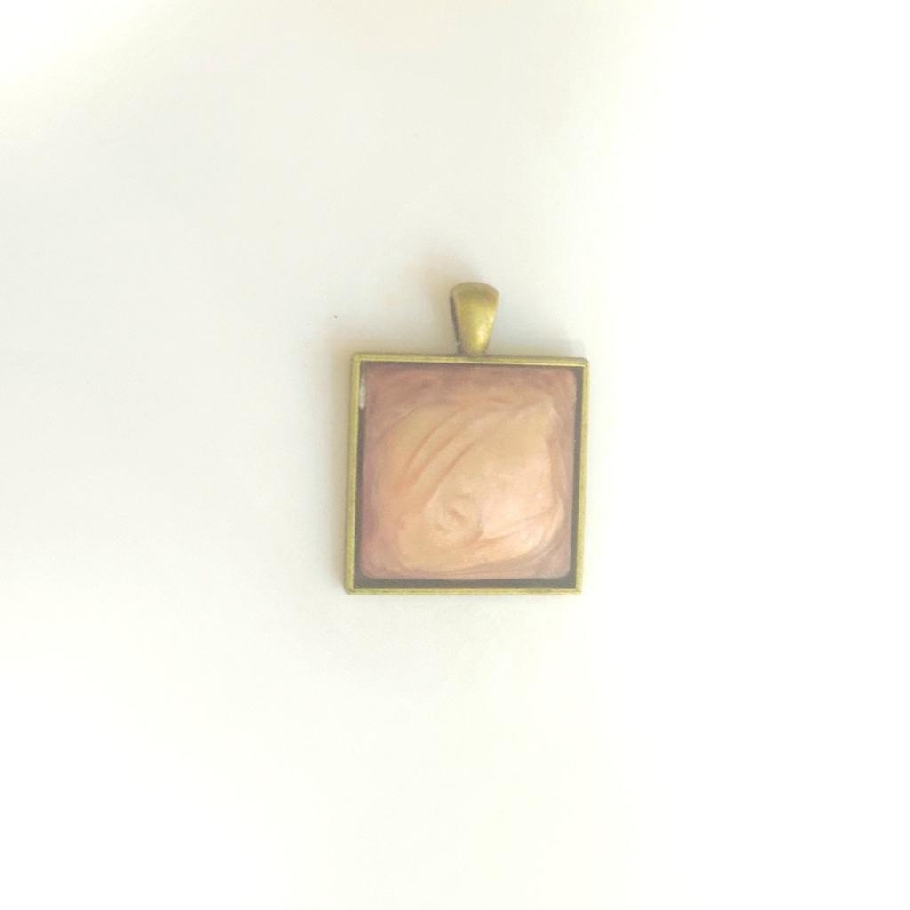 Rose resin bronze tone pendant