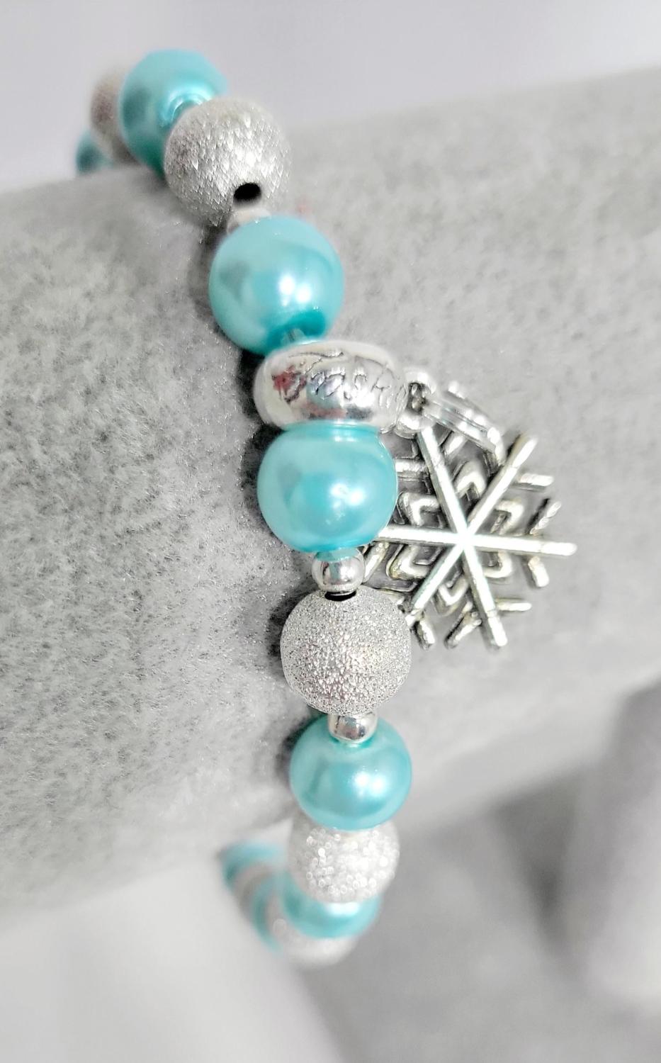 Ice blue glass beaded snowflake charm bracelet